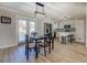 Bright dining area features hardwood floors and modern light fixture at 912 Northridge Nw Dr, Conyers, GA 30012