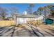 Front view of house with driveway and new fence at 912 Northridge Nw Dr, Conyers, GA 30012