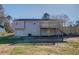 Back of house with attached deck and fenced yard at 912 Northridge Nw Dr, Conyers, GA 30012