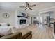 Living room with stone fireplace and hardwood floors at 912 Northridge Nw Dr, Conyers, GA 30012