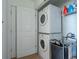 Laundry room with stacked washer and dryer at 860 Peachtree Ne St # 2104, Atlanta, GA 30308