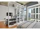 Modern bedroom with room divider and hardwood floors at 943 Peachtree Ne St # 1109, Atlanta, GA 30309