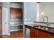 Modern kitchen with stainless steel appliances and wood cabinets at 943 Peachtree Ne St # 1109, Atlanta, GA 30309