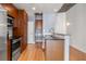 Modern kitchen with stainless steel appliances and wood cabinets at 943 Peachtree Ne St # 1109, Atlanta, GA 30309