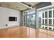 Hardwood floors and floor to ceiling windows in living room at 943 Peachtree Ne St # 1109, Atlanta, GA 30309