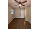 Bright bedroom with wood floors and a ceiling fan at 116 E Wade St, Oxford, GA 30054
