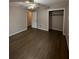 Large bedroom featuring wood floors and ample closet space at 116 E Wade St, Oxford, GA 30054
