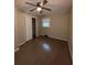 Well-lit bedroom with wood floors and built-in closet at 116 E Wade St, Oxford, GA 30054