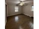 Spacious bedroom with wood floors and ceiling fan at 116 E Wade St, Oxford, GA 30054