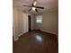 Spacious bedroom with wood floors and closet at 116 E Wade St, Oxford, GA 30054
