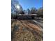 Brick ranch house with a large yard and driveway at 116 E Wade St, Oxford, GA 30054