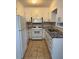 Kitchen with white cabinets, granite counters at 116 E Wade St, Oxford, GA 30054
