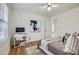 Cozy bedroom with hardwood floors, workspace and ceiling fan at 3696 Winbrooke Ln, Tucker, GA 30084