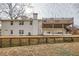 Two-story house with white exterior and large deck at 3696 Winbrooke Ln, Tucker, GA 30084