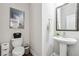 Powder room with pedestal sink and decorative mirror at 505 Stagecoach Bnd, Smyrna, GA 30080