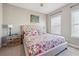Comfortable bedroom with a queen-size bed and floral bedding at 505 Stagecoach Bnd, Smyrna, GA 30080