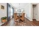 Dining room with round table, wicker chairs, and hardwood floors at 505 Stagecoach Bnd, Smyrna, GA 30080