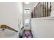 View from upstairs of the entryway with staircase and console table at 505 Stagecoach Bnd, Smyrna, GA 30080
