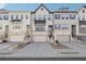 Three-story townhouses with attached garages and front stairs at 505 Stagecoach Bnd, Smyrna, GA 30080