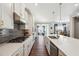 Modern kitchen with white cabinets, stainless steel appliances, and breakfast bar at 505 Stagecoach Bnd, Smyrna, GA 30080