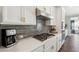 Modern kitchen with white cabinets, gas cooktop, and stylish backsplash at 505 Stagecoach Bnd, Smyrna, GA 30080