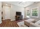 Comfortable living room with hardwood floors and access to a patio at 505 Stagecoach Bnd, Smyrna, GA 30080