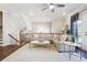 Spacious living room with sectional sofa, hardwood floors, and access to upper floor at 505 Stagecoach Bnd, Smyrna, GA 30080