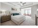 Spacious main bedroom with tray ceiling, ceiling fan, and sitting area at 505 Stagecoach Bnd, Smyrna, GA 30080