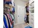 Large walk-in closet with hanging rods and storage shelves at 505 Stagecoach Bnd, Smyrna, GA 30080