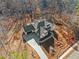 Aerial view of house and surrounding wooded area at 221 Heritage Town Pkwy, Canton, GA 30115