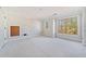 Spacious unfinished bedroom with large windows and wood flooring at 221 Heritage Town Pkwy, Canton, GA 30115