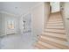 Bright entryway with staircase and view to living room at 221 Heritage Town Pkwy, Canton, GA 30115
