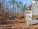 Side view of house with wooded lot in background at 221 Heritage Town Pkwy, Canton, GA 30115