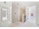 Upstairs hallway with stairs and doors to bedrooms at 221 Heritage Town Pkwy, Canton, GA 30115