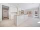 Open concept kitchen with white cabinets and an island at 221 Heritage Town Pkwy, Canton, GA 30115