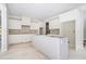 Spacious kitchen with white cabinets and a large island at 221 Heritage Town Pkwy, Canton, GA 30115