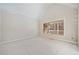 Living room with vaulted ceiling and large windows at 221 Heritage Town Pkwy, Canton, GA 30115
