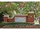 Brick entryway sign with landscaping and flowering plants at 3404 Westchester Ne Rdg, Brookhaven, GA 30329