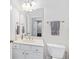 Clean bathroom with white vanity, toilet and mirror at 2317 Saint Davids Nw Sq, Kennesaw, GA 30152