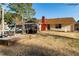 Backyard featuring an enclosed patio, offering a private and cozy outdoor space at 1830 Brandy Se Ln, Conyers, GA 30013
