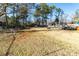 Spacious backyard with a gazebo, surrounded by mature trees, offers space for outdoor activities at 1830 Brandy Se Ln, Conyers, GA 30013