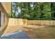 Simple backyard with wood fence and small patio at 2256 Barge Sw Rd, Atlanta, GA 30331