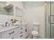 Modern bathroom with double vanity, marble countertop and walk-in shower at 2256 Barge Sw Rd, Atlanta, GA 30331