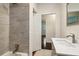 Updated bathroom features a gray tile shower and modern vanity at 2256 Barge Sw Rd, Atlanta, GA 30331