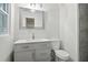 Modern bathroom with gray vanity and shower at 2256 Barge Sw Rd, Atlanta, GA 30331