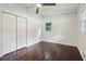 Well-lit bedroom with dark hardwood floors and window at 2256 Barge Sw Rd, Atlanta, GA 30331