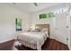 Bedroom featuring hardwood floors and a view of the backyard at 2256 Barge Sw Rd, Atlanta, GA 30331