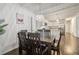 Spacious dining room with view of updated kitchen, hardwood floors and stylish light fixture at 2256 Barge Sw Rd, Atlanta, GA 30331