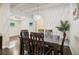 Open dining room features dark wood table and chairs, hardwood floors, and view into living room at 2256 Barge Sw Rd, Atlanta, GA 30331