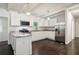 Modern kitchen with white cabinets, stainless steel appliances, and granite countertops at 2256 Barge Sw Rd, Atlanta, GA 30331